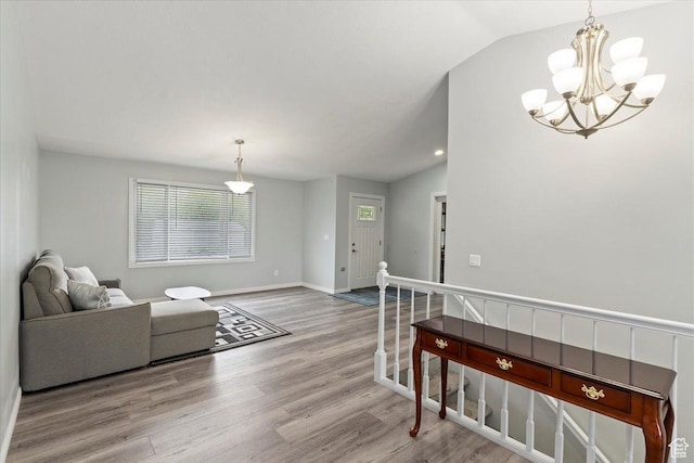 4612 S 600 E, Murray, UT 84107 - living area with a chandelier, wood finished floors, and vaulted ceiling