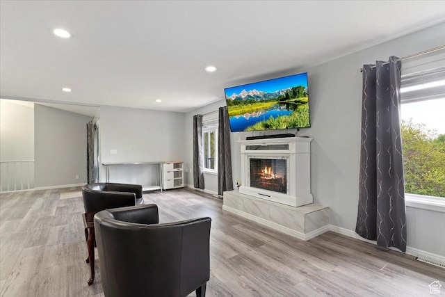 4612 S 600 E, Murray, UT 84107 - living room featuring a lit fireplace, recessed lighting, wood finished floors, and visible vents