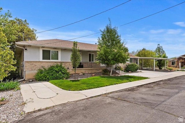 4612 S 600 E, Murray, UT 84107 - single story home featuring roof with shingles, a front lawn, brick siding, stucco siding, and a carport
