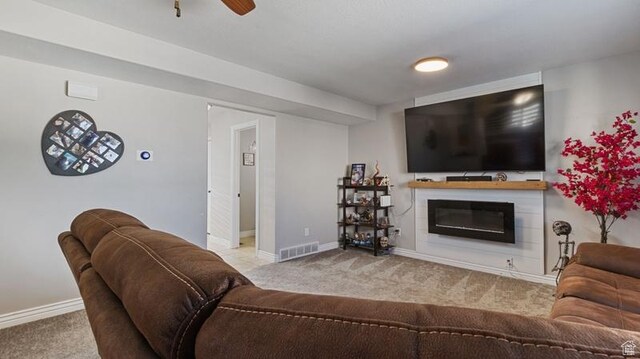 2077 N 1450 W, Clinton, UT 84015 - living area featuring carpet floors, baseboards, visible vents, and a glass covered fireplace