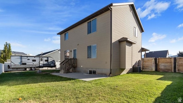 2077 N 1450 W, Clinton, UT 84015 - back of house with fence, a lawn, a patio area, and central AC
