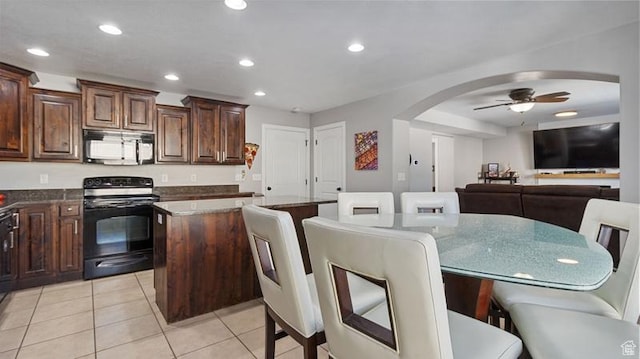 2077 N 1450 W, Clinton, UT 84015 - kitchen with electric range, arched walkways, a center island, recessed lighting, and a ceiling fan