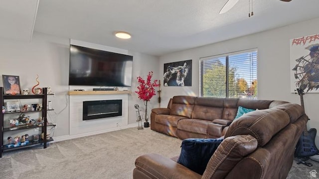 2077 N 1450 W, Clinton, UT 84015 - carpeted living room featuring baseboards, a ceiling fan, and a glass covered fireplace