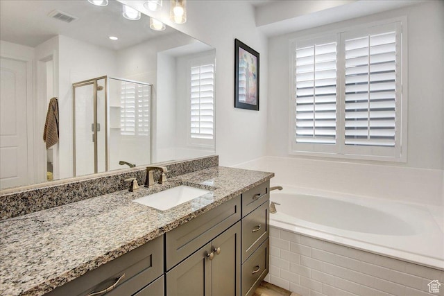 6264 W Antelope Flat Way S, Herriman, UT 84096 - full bathroom featuring visible vents, vanity, a healthy amount of sunlight, and a shower stall