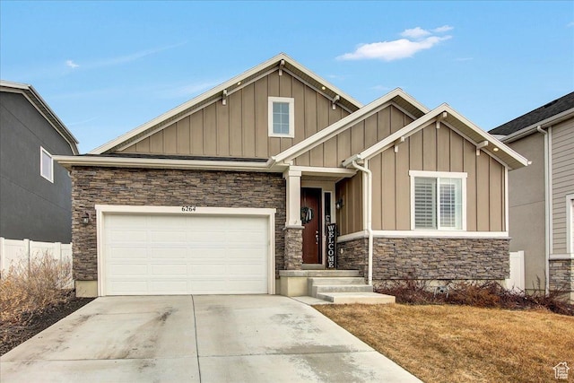 6264 W Antelope Flat Way S, Herriman, UT 84096 - craftsman-style house with board and batten siding, a garage, fence, concrete driveway, and stone siding