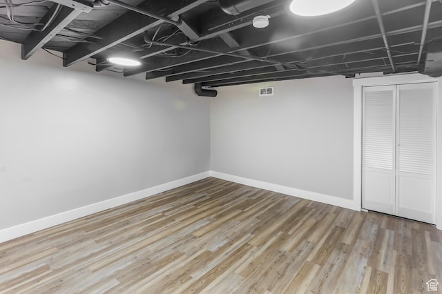 987 S Jefferson Ave E, Ogden, UT 84404 - finished below grade area with baseboards, visible vents, and wood finished floors