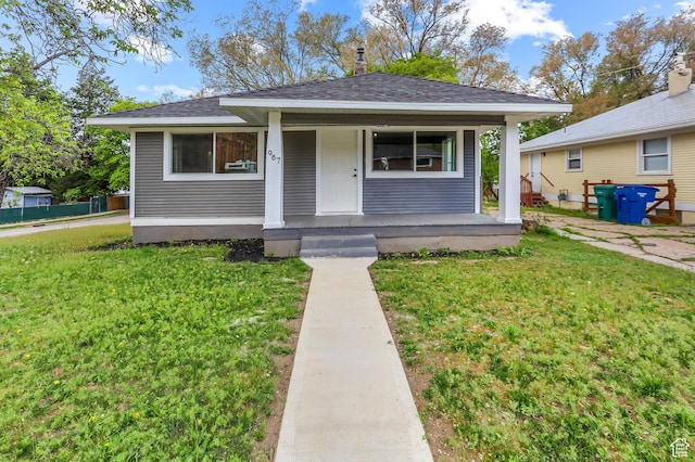 987 S Jefferson Ave E, Ogden, UT 84404 - bungalow-style house with a porch, a shingled roof, and a front yard