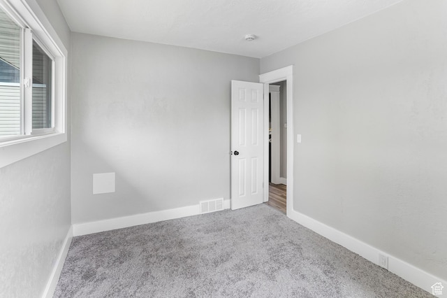 987 S Jefferson Ave E, Ogden, UT 84404 - empty room featuring baseboards, carpet, and visible vents