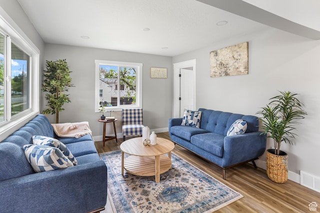 987 S Jefferson Ave E, Ogden, UT 84404 - living room featuring baseboards, wood finished floors, and visible vents