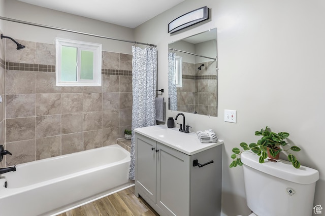 987 S Jefferson Ave E, Ogden, UT 84404 - full bathroom featuring toilet, shower / bathtub combination with curtain, wood finished floors, and vanity