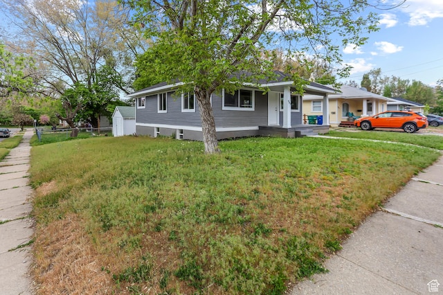 987 S Jefferson Ave E, Ogden, UT 84404 - view of front facade featuring covered porch and a front yard