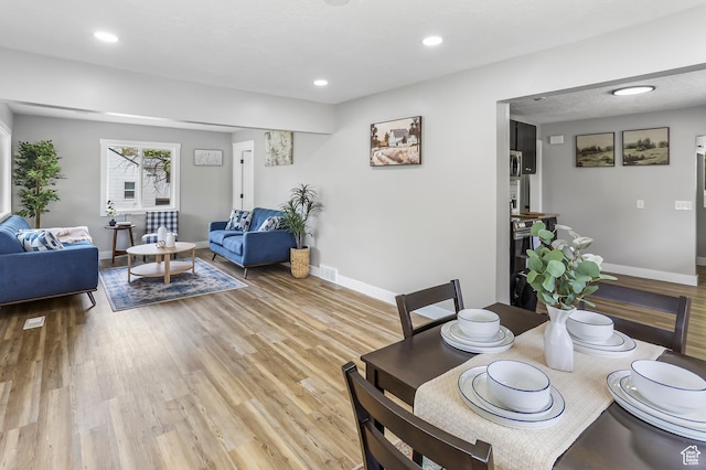 987 S Jefferson Ave E, Ogden, UT 84404 - dining space with recessed lighting, baseboards, and light wood finished floors