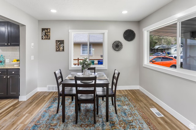 987 S Jefferson Ave E, Ogden, UT 84404 - dining room with baseboards, light wood-style flooring, and visible vents