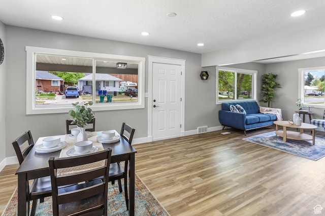 987 S Jefferson Ave E, Ogden, UT 84404 - dining space with visible vents, baseboards, plenty of natural light, and wood finished floors