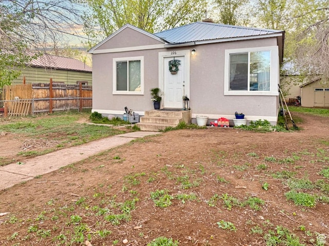 226 N 400 E, Vernal, UT 84078 - bungalow-style home featuring fence, metal roof, and stucco siding