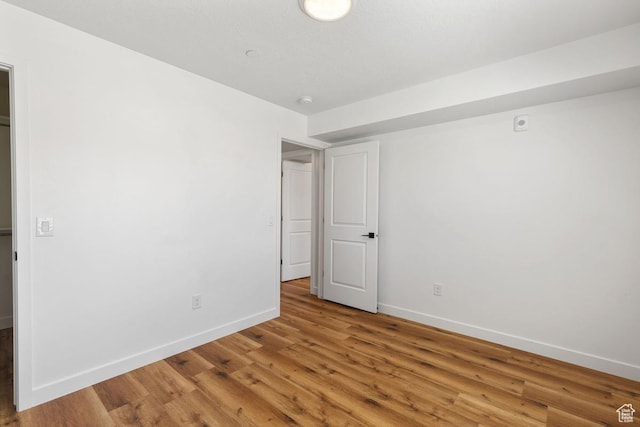 468 W Main St, Santaquin, UT 84655 - unfurnished bedroom featuring baseboards and light wood-style floors