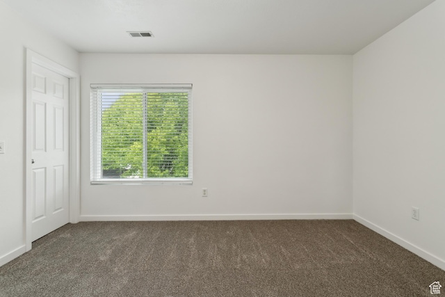 11572 S Harvest Rain Ave, South Jordan, UT 84009 - unfurnished bedroom with dark colored carpet and baseboards