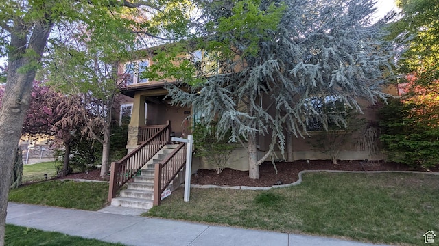 11572 S Harvest Rain Ave, South Jordan, UT 84009 - view of property hidden behind natural elements featuring a front lawn and stucco siding