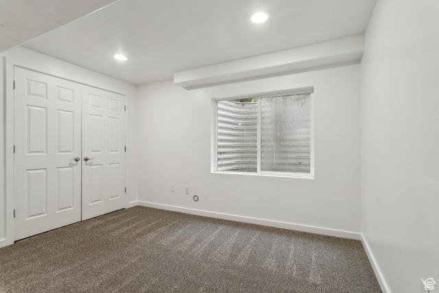 11572 S Harvest Rain Ave, South Jordan, UT 84009 - unfurnished bedroom featuring dark carpet, baseboards, recessed lighting, and a closet