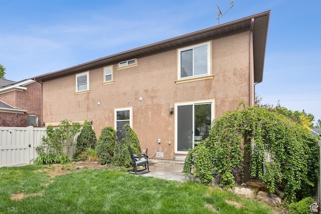 11572 S Harvest Rain Ave, South Jordan, UT 84009 - rear view of house featuring stucco siding and a patio