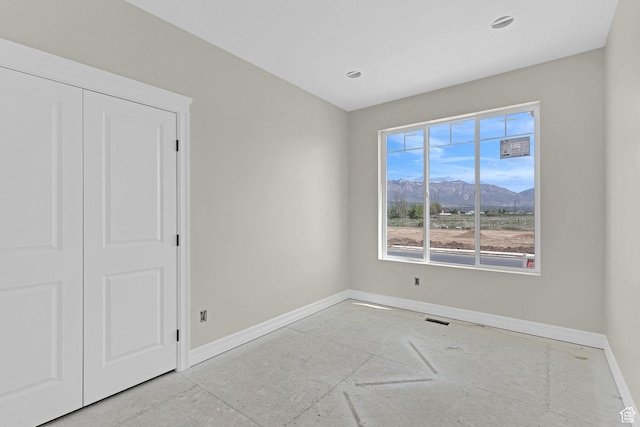 2881 N 3475 W Unit 17, Plain City, UT 84404 - spare room featuring baseboards, recessed lighting, a mountain view, and visible vents