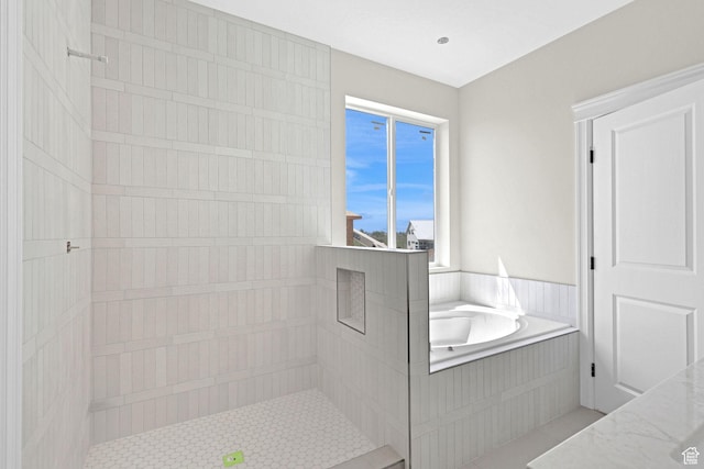 2881 N 3475 W Unit 17, Plain City, UT 84404 - bathroom with tile patterned flooring, a garden tub, and tiled shower