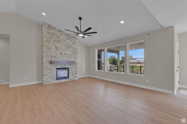 2881 N 3475 W Unit 17, Plain City, UT 84404 - unfurnished living room with lofted ceiling, a ceiling fan, light wood finished floors, and a fireplace