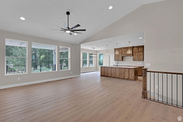 2881 N 3475 W Unit 17, Plain City, UT 84404 - unfurnished living room featuring light wood-style floors, a ceiling fan, recessed lighting, and high vaulted ceiling