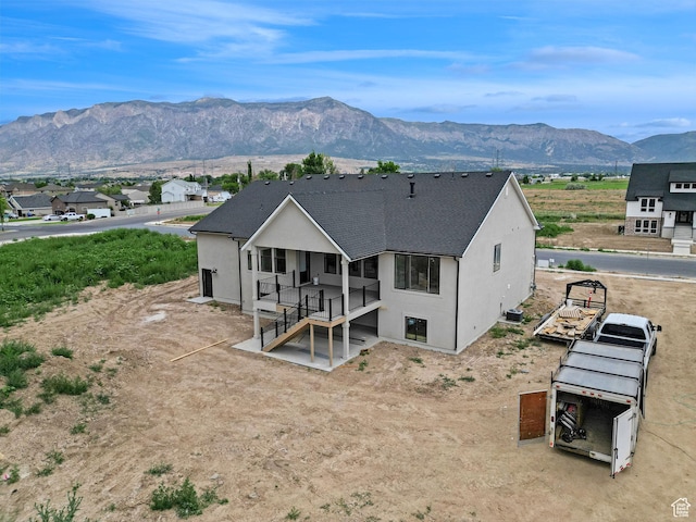 2881 N 3475 W Unit 17, Plain City, UT 84404 - rear view of house featuring stucco siding and a mountain view