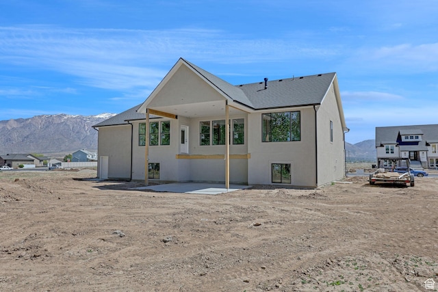 2881 N 3475 W Unit 17, Plain City, UT 84404 - back of property with a mountain view, stucco siding, and a patio area