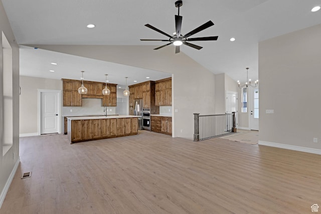 2881 N 3475 W Unit 17, Plain City, UT 84404 - unfurnished living room with light wood-style floors, a chandelier, recessed lighting, a ceiling fan, and high vaulted ceiling