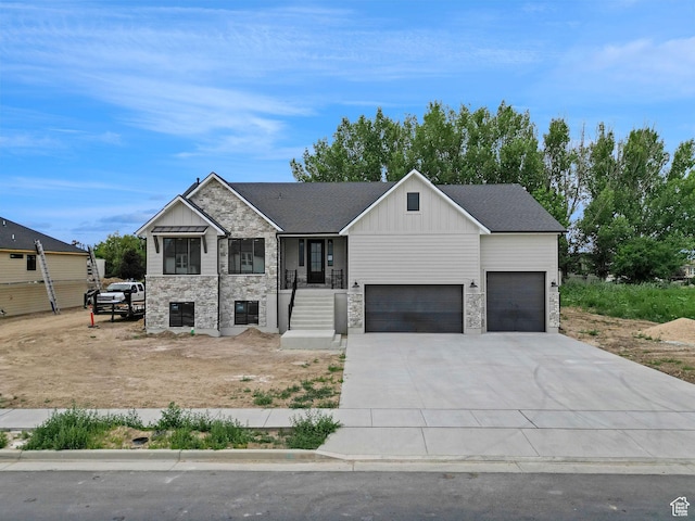 2881 N 3475 W Unit 17, Plain City, UT 84404 - view of front of home featuring stone siding, board and batten siding, driveway, and an attached garage