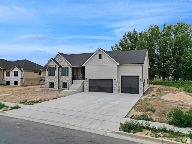 2881 N 3475 W Unit 17, Plain City, UT 84404 - modern farmhouse style home featuring board and batten siding, an attached garage, concrete driveway, and stone siding