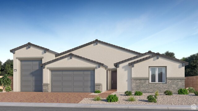 590 S Cecita Way, St George, UT 84770 - ranch-style home with a tile roof, an attached garage, driveway, and stucco siding