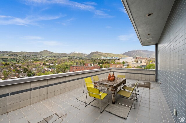 1235 E 200th St S Unit 1001, Salt Lake City, UT 84102 - balcony featuring outdoor dining area and a mountain view