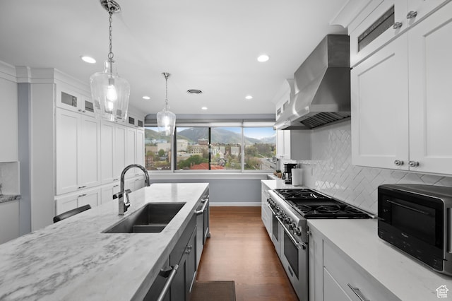 1235 E 200th St S Unit 1001, Salt Lake City, UT 84102 - kitchen featuring baseboards, wall chimney range hood, recessed lighting, a sink, and double oven range