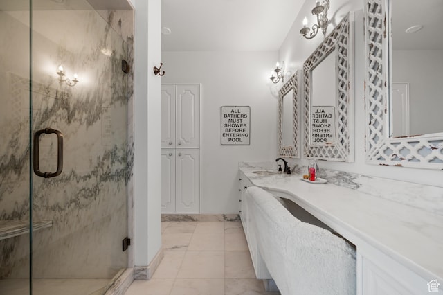 1235 E 200th St S Unit 1001, Salt Lake City, UT 84102 - bathroom featuring a marble finish shower, baseboards, vanity, and marble finish floor