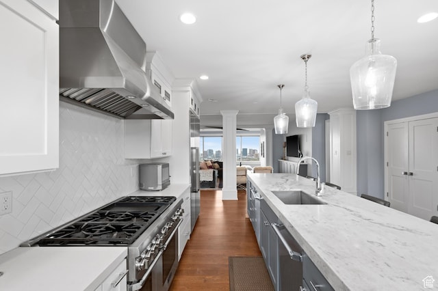 1235 E 200th St S Unit 1001, Salt Lake City, UT 84102 - kitchen featuring ornate columns, a sink, stainless steel appliances, and wall chimney exhaust hood
