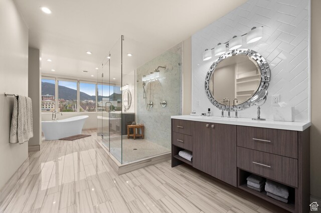 1235 E 200th St S Unit 1001, Salt Lake City, UT 84102 - full bath with vanity, recessed lighting, a shower stall, a mountain view, and a soaking tub