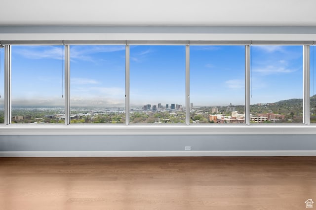1235 E 200th St S Unit 1001, Salt Lake City, UT 84102 - unfurnished sunroom featuring a view of city and a wealth of natural light