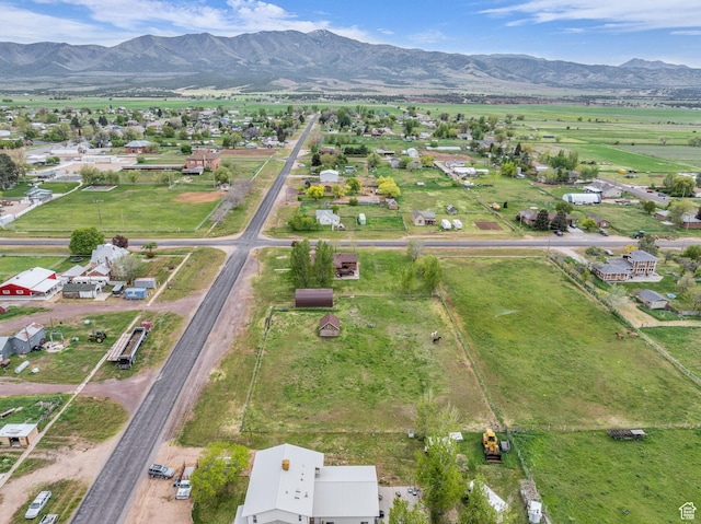 birds eye view of property with a mountain view