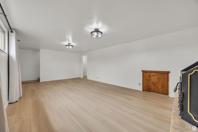 unfurnished living room with light wood finished floors