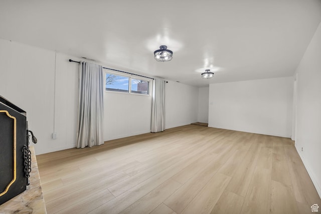 unfurnished living room featuring light wood-type flooring