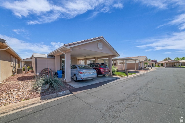 2990 E Riverside Dr Unit 118, St George, UT 84790 - view of vehicle parking with a residential view and a carport