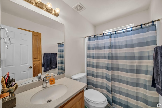 2990 E Riverside Dr Unit 118, St George, UT 84790 - bathroom featuring toilet, a shower with curtain, visible vents, and vanity