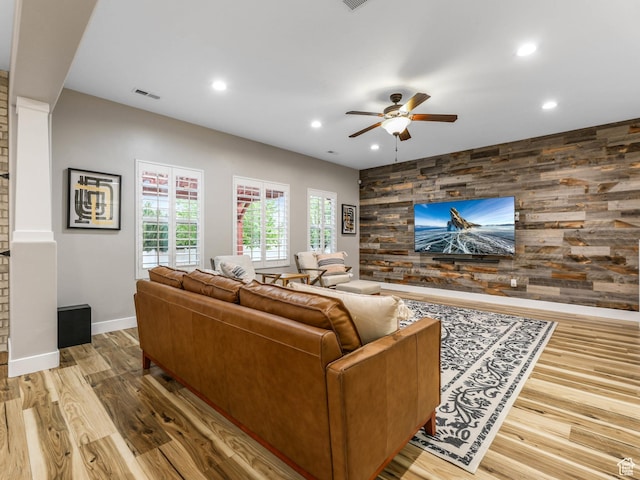 5764 Greenwich Cir, Stansbury Park, UT 84074 - living room featuring visible vents, an accent wall, baseboards, ceiling fan, and recessed lighting
