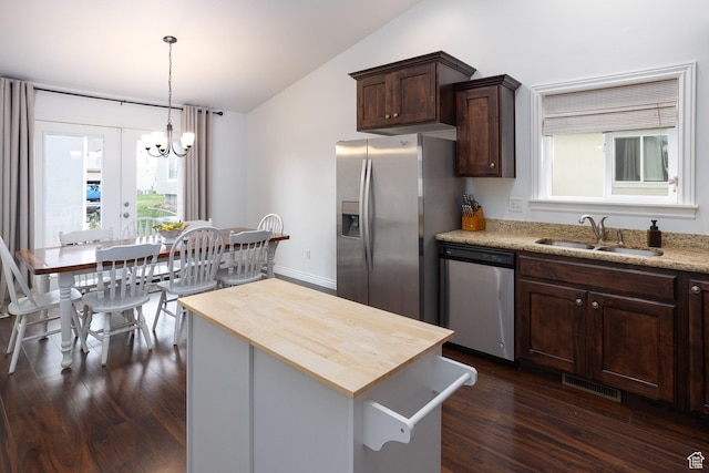 940 N 90 W, Santaquin, UT 84655 - kitchen with appliances with stainless steel finishes, lofted ceiling, wood counters, dark wood-type flooring, and a chandelier