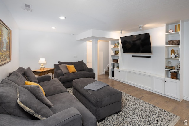 940 N 90 W, Santaquin, UT 84655 - living room with wood finished floors, decorative columns, stairs, and recessed lighting