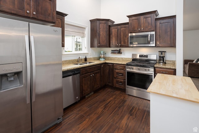 940 N 90 W, Santaquin, UT 84655 - kitchen featuring stainless steel appliances, dark brown cabinets, butcher block countertops, and dark wood finished floors