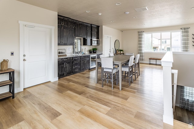940 N 90 W, Santaquin, UT 84655 - dining room with wine cooler, light wood finished floors, and recessed lighting